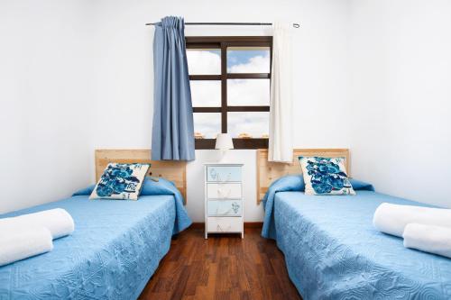 Posteľ alebo postele v izbe v ubytovaní FTV Holidays Homes