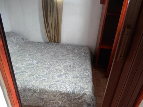 Una cama o camas en una habitación de Complejo Miranieves, Se alquila casa para 3 personas en Miramar Costa Atlantica