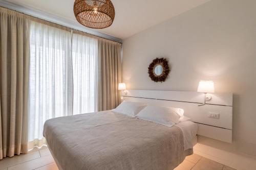 Una cama o camas en una habitación de Vistamare Suite