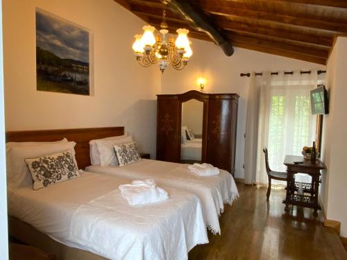 Ένα ή περισσότερα κρεβάτια σε δωμάτιο στο Quinta do Bravio