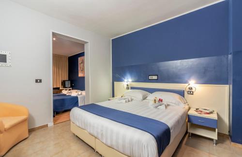 Posteľ alebo postele v izbe v ubytovaní El Patio Hotel