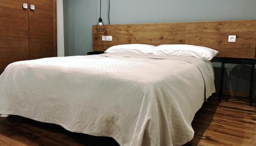 Кровать или кровати в номере Mangata