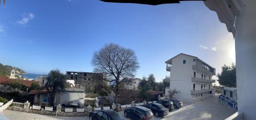 a group of cars parked next to a building at Sofo Hotel Dhermi in Dhërmi