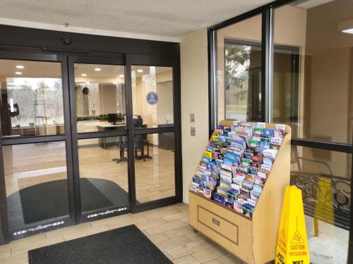 a store with a stack of books on a box at Baymont by Wyndham Bridgeport/Frankenmuth in Bridgeport