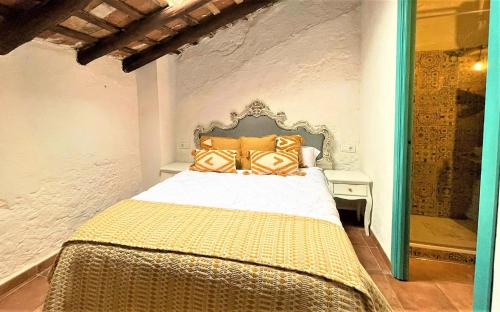 מיטה או מיטות בחדר ב-La casa de David Brito