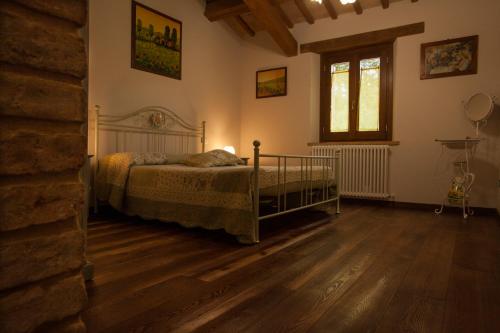 A bed or beds in a room at Quelli del Picchio