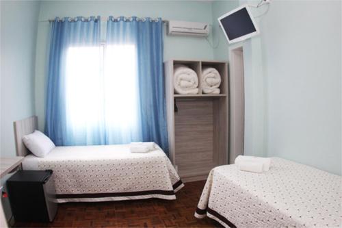 Katil atau katil-katil dalam bilik di Hotel Condá