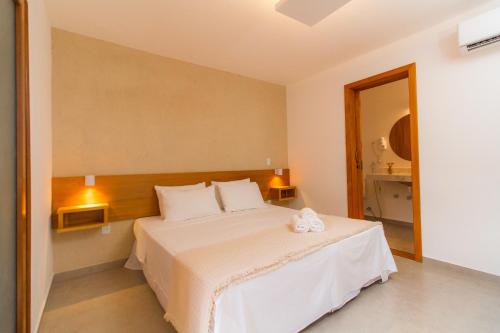 Ένα ή περισσότερα κρεβάτια σε δωμάτιο στο Tororao Hotel Pousada