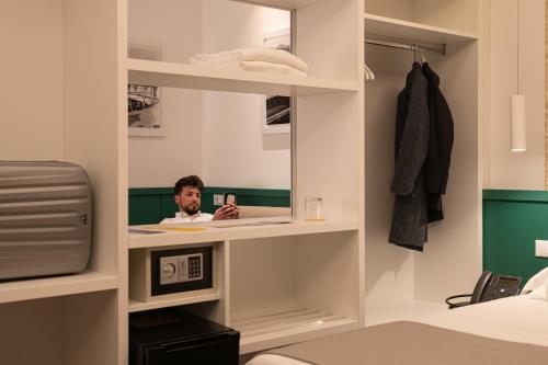 Smart Hotel Napoliにあるベッド