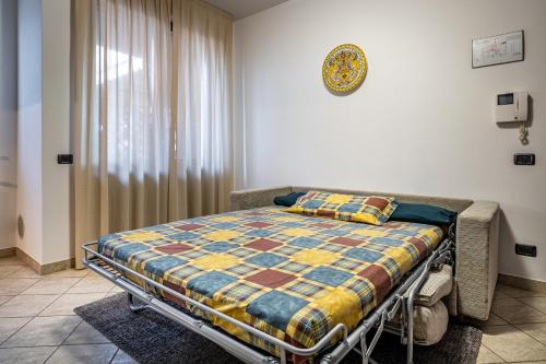 a hospital bed with a quilt on it in a room at Casa Vacanze Arianna in Rosia
