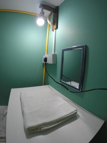 Una cama o camas en una habitación de CoCo Guesthouse Kemaman