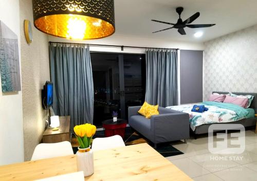 a living room with a bed and a dining room table at Netflix WiFi Cozy Homestay Trefoil Setia Alam Shah Alam 沙亚南舒适温馨日租民宿 in Setia Alam