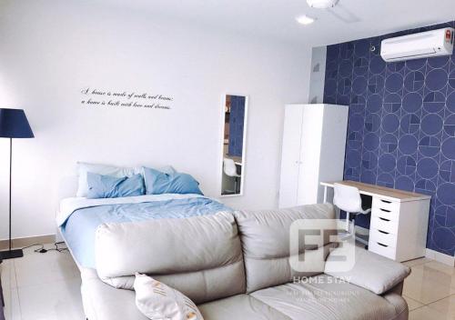 a living room with a couch and a bed at Netflix WiFi Cozy Homestay Trefoil Setia Alam Shah Alam 沙亚南舒适温馨日租民宿 in Setia Alam