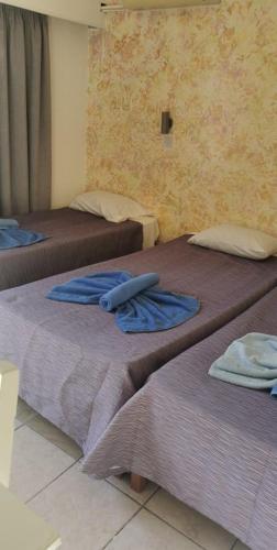 Postel nebo postele na pokoji v ubytování Simos Magic Hotel Apts