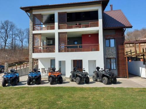a group of motorcycles parked in front of a house at Casa Sarti in Eşelniţa