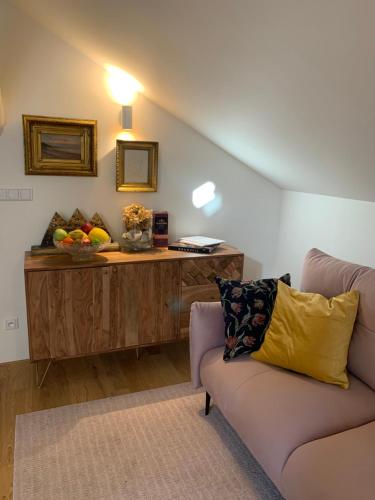 a living room with a couch and a table at Kalina Apartments in Brno