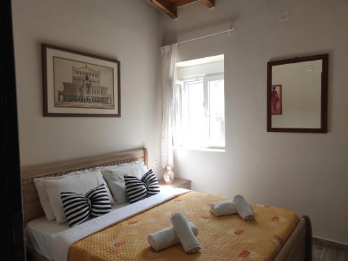 a bedroom with a bed with two teddy bears on it at Villa Asterousia in Stérnai