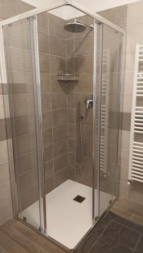 a shower with a glass enclosure in a bathroom at Appartamenti Casa San Nicolò in Malcesine