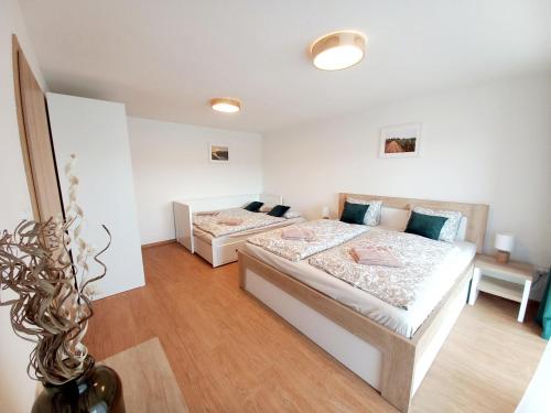Apartmány Olšovskáにあるベッド