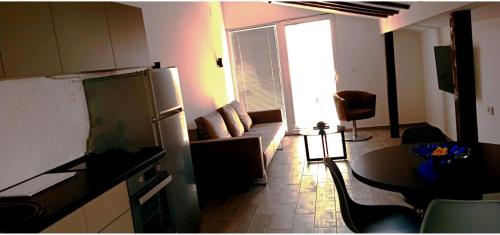 a living room with a couch and a table at Villa Passage in Ohrid