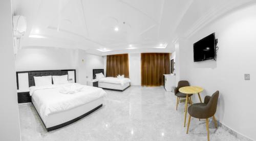 Cama o camas de una habitación en عبري كاسل هوتيل