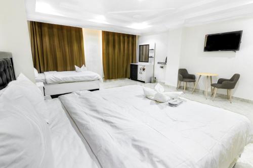 Cama o camas de una habitación en عبري كاسل هوتيل