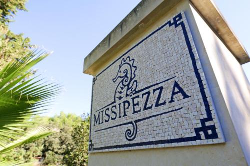 a sign on the side of a building at Missipezza Residence a Frassanito in Alimini