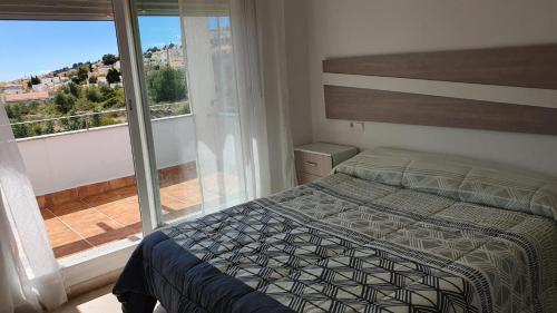 Postel nebo postele na pokoji v ubytování CALA HOUSE II Luminoso adosado con vistas,piscina comunitaria y parking incluido