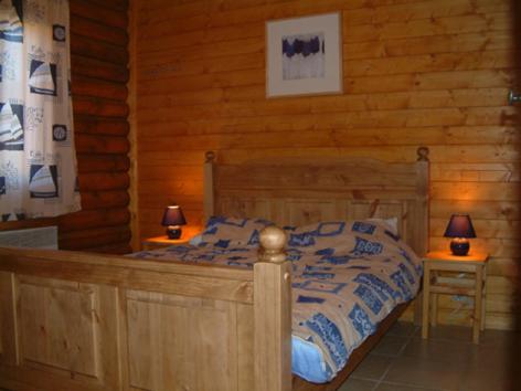 Кровать или кровати в номере Le Chalet des Vosges