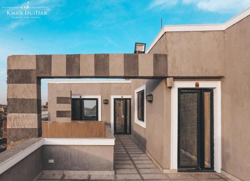 a building with its doors open on the roof at Khan Duidar Inn - Pyramids View Rooftop in Cairo