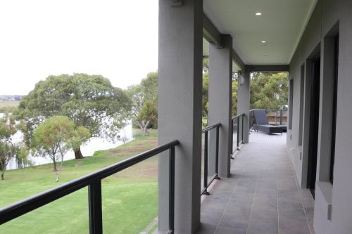 a balcony with a view of a park at River Devine in White Sands