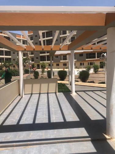 a view of a building with columns and awning at Mo Residence SD City in Dakar