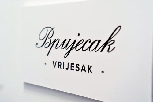 a sign that reads farewell vyssak on a wall at Herceg Vila in Trebinje