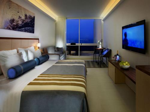 Postel nebo postele na pokoji v ubytování Club Hotel Tiberias - Suites Hotel
