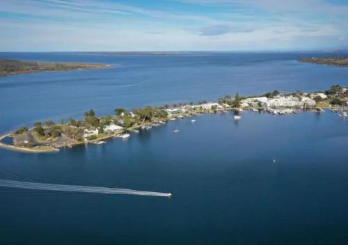 an island in the middle of a large body of water at Metung Akora 2Bdrm Apartment 1 - Pets & Boats welcome! Close to Town, Free Wifi & Netflix in Metung