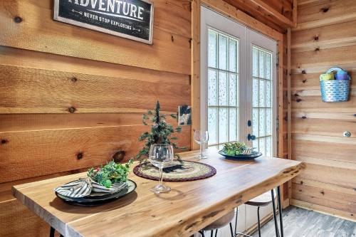 a dining room with a wooden table in a cabin at Bearly Gnomey in Gatlinburg