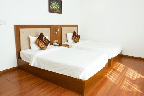Ένα ή περισσότερα κρεβάτια σε δωμάτιο στο Centre Hotel