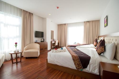 Ένα ή περισσότερα κρεβάτια σε δωμάτιο στο Centre Hotel