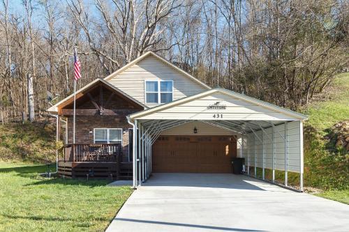 a house with a garage with a flag at Hideaway Cove in Sevierville