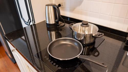 a pot sitting on top of a stove at BAAN 125 STAY Phuket in Phuket Town