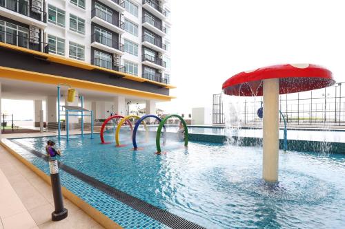 a pool with a water slide in a building at Novo 8 Premium Malacca By I Housing in Melaka