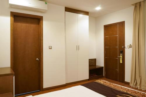 Ένα ή περισσότερα κρεβάτια σε δωμάτιο στο Centre Hotel