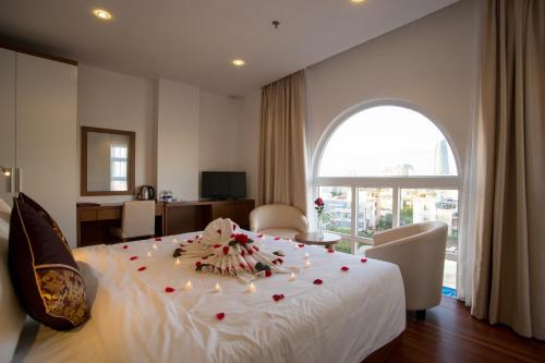 Ένα ή περισσότερα κρεβάτια σε δωμάτιο στο Centre Hotel