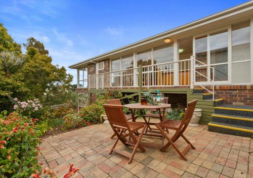 a patio with a table and chairs in front of a house at BerwickHills Stylish 3 BdrmHome *Free Wifi*NetFlix in Berwick