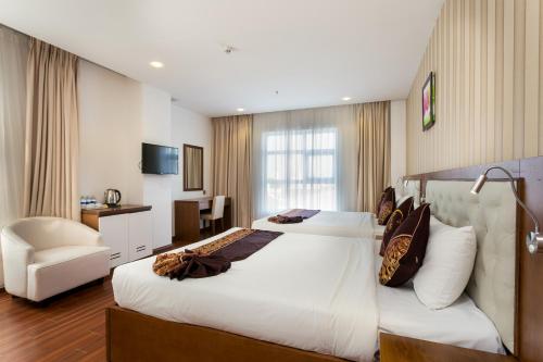 Ένα ή περισσότερα κρεβάτια σε δωμάτιο στο Centre Hotel