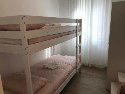 a couple of bunk beds in a room at Chioggia House di Davide in Chioggia