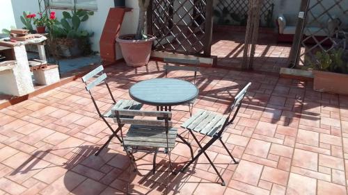 a table and chairs sitting on a patio at Alla Busiata in Trapani