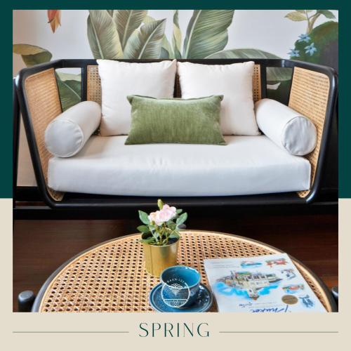 a living room with a couch and a table at BAAN 125 STAY Phuket in Phuket Town