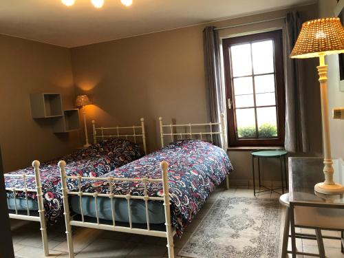Ένα ή περισσότερα κρεβάτια σε δωμάτιο στο Au Coeur des Collines, Charmette