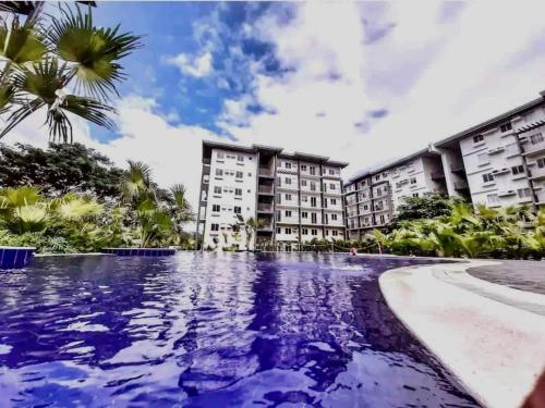 a view of the hotel from the swimming pool at Amaia Steps Nuvali fully furnished unit with swimming pool view near Carmelray Pitland in Calamba